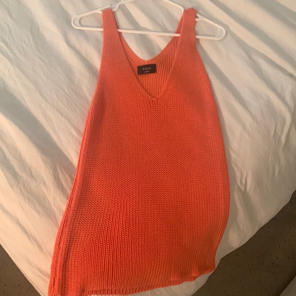 An orange tank top from Vici! Never worn and a size large.